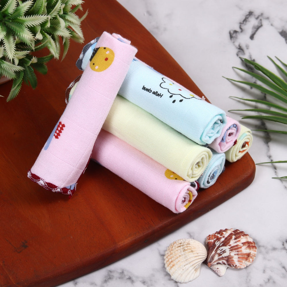 Rolled printed cotton face towels in pastel colours