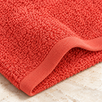 Jenny Denial Rust cotton terry face towel — terry fabric and hem detail, 400 GSM