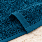 Jenny Denial Teal cotton terry face towel — terry fabric and hem detail, 400 GSM