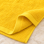Jenny Denial Yellow cotton terry face towel — terry fabric and hem detail, 400 GSM